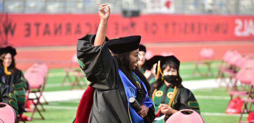 UIW 2021 Med School Graduate Pointing To The Sky